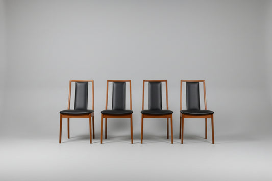 Restored Noblett Boston T-back mid-century modern dining chairs showing open ladder back design and teak legs