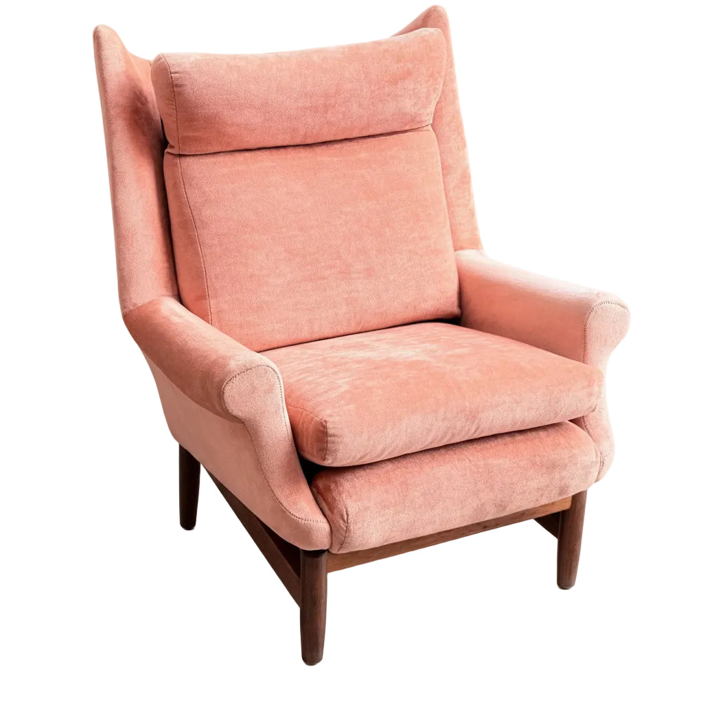 A pair of vintage mid-century high-back/wingback armchairs in dusty pink velvet, featuring cushioned seats and wooden legs, set against a plain gray background. Coming soon.