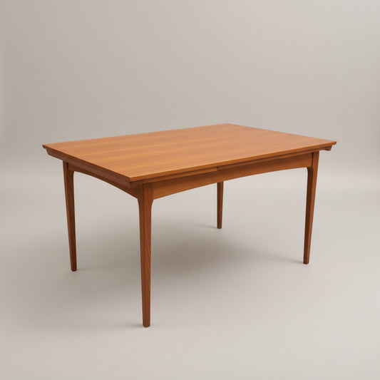 The Fler 64 Rectangular Extension Table (Refine) features a smooth, light brown finish and tapered legs, set against a plain light gray background—a refined tribute to vintage Australian design.