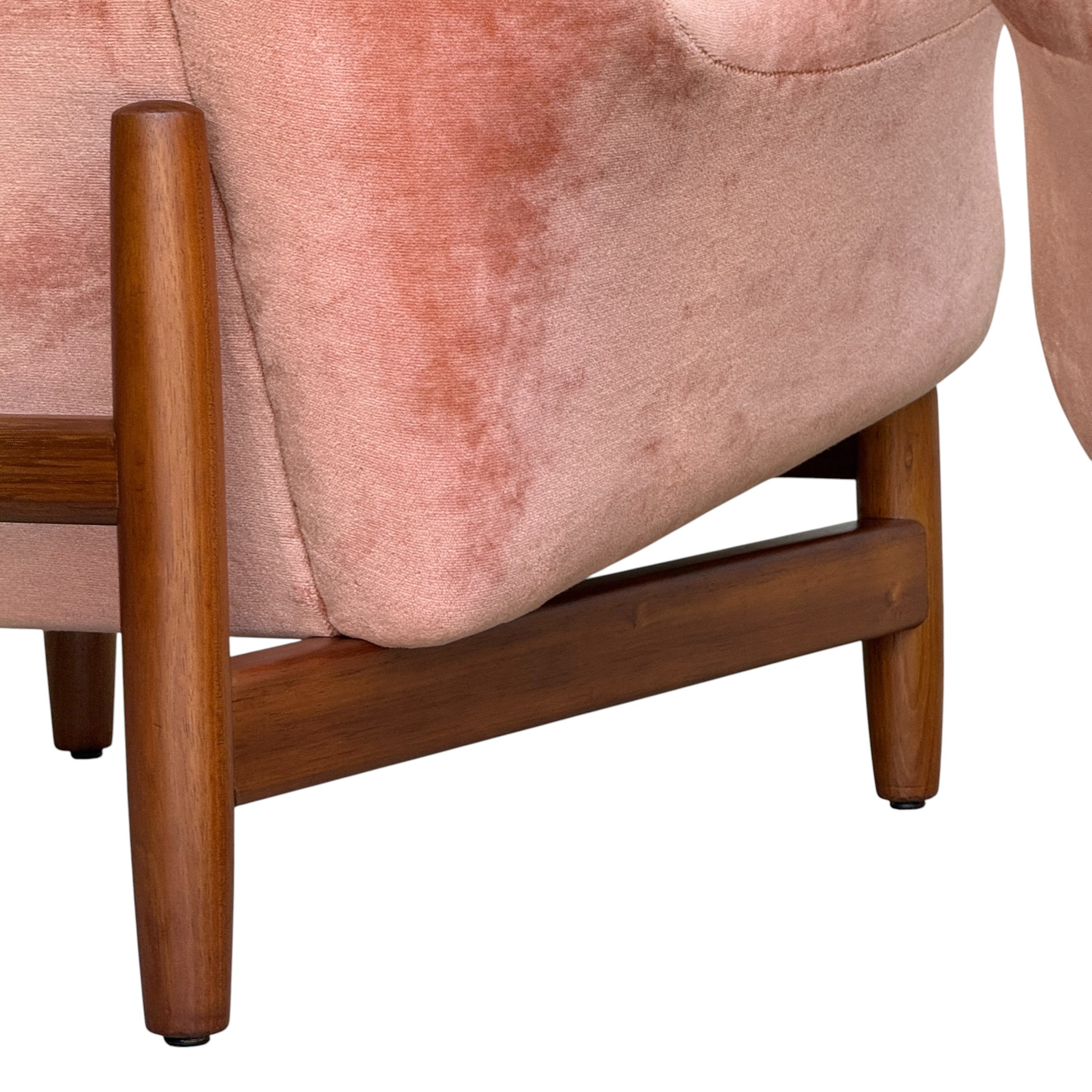 Close-up of a Mid-Century High-Back/Wingback Armchair in dusty pink velvet with a blackwood frame, showcasing its soft upholstery and polished wood details. Product: Priced individually, Rediscover collection.