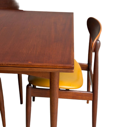 A close-up of the Vintage Mid-Century Parker 109 Nordic Extension Dining Table (Revive), showcasing its sleek rounded edges, set against a white background.