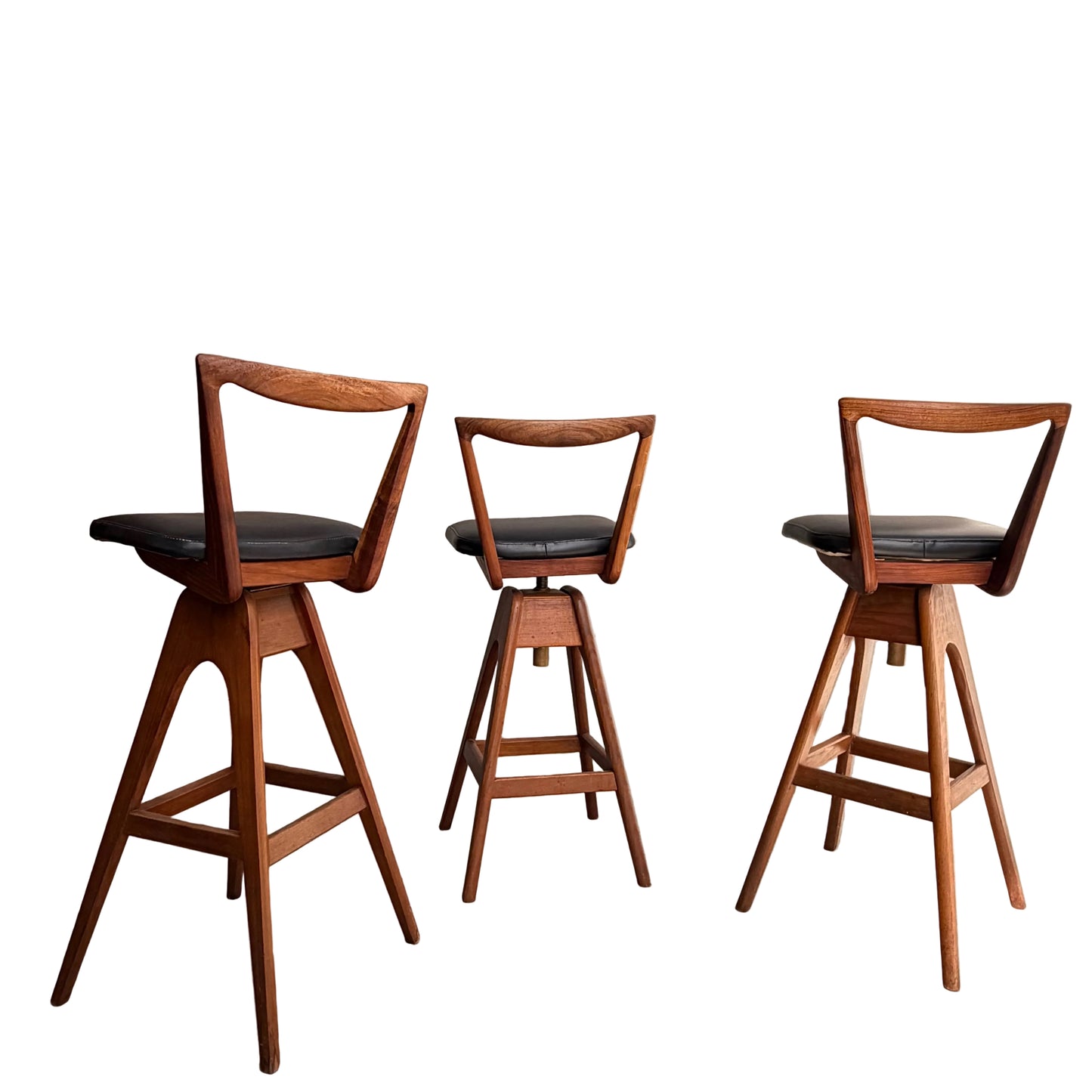 A Set of 3 Vintage THB Bar Stools - COMING SOON features black cushioned seats, mid-century modern triangular open-backs, and angled legs arranged in a row against a white background.