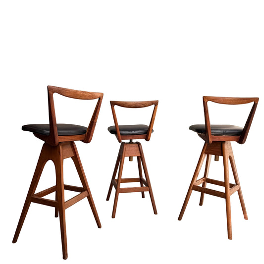 A Set of 3 Vintage THB Bar Stools - COMING SOON features black cushioned seats, mid-century modern triangular open-backs, and angled legs arranged in a row against a white background.