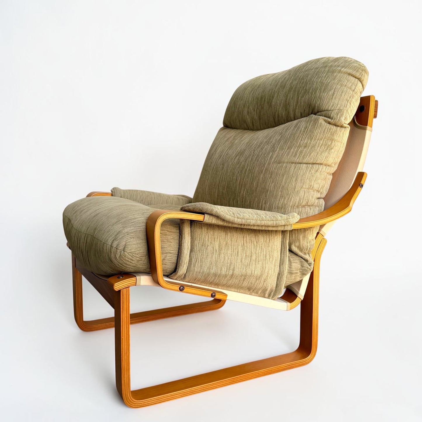 A pair of Tessa Monaco Arm Chairs in sage green corduroy, like new from Revive, feature a reclining design and padded armrests inspired by classic mid-century comfort, shown against a plain white background.