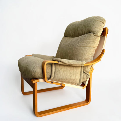 A pair of Tessa Monaco Arm Chairs in sage green corduroy, like new from Revive, feature a reclining design and padded armrests inspired by classic mid-century comfort, shown against a plain white background.