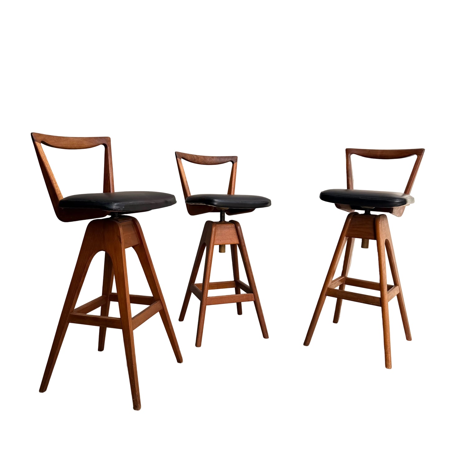 Set of 3 Vintage THB Bar Stools - COMING SOON: These mid-century modern stools feature dark upholstered seats, angled legs, and triangular open backrests, arranged on a white background with a clean, minimalist design.