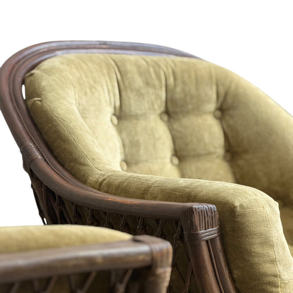 Close-up of the Vintage Adrian Pearsall Style 1970s Rattan Designer Barrel Chair in olive green velvet, highlighting its curved rattan frame and button-tufted backrest with armrest details against a white background.