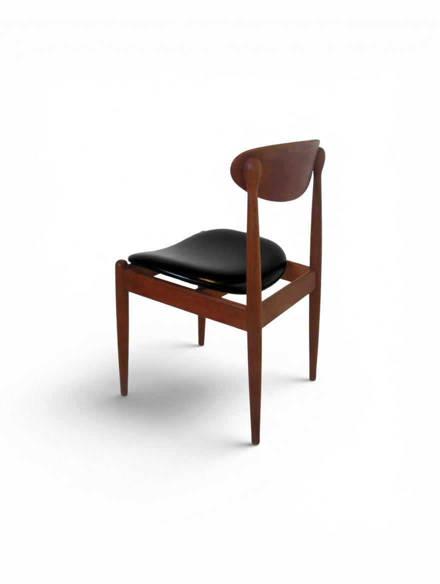 Set of 4 Parker 107 Matchstick chairs—COMING SOON. Featuring mid-century modern design, curved backrests, and black padded seats, photographed at an angle on a white background. Ideal for fans of Australian furniture style.