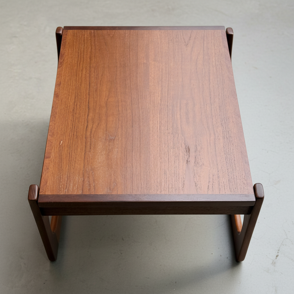 The Ultra Rare Gerald Easden Coffee Table in Blackwood with a sleigh leg base (Rediscover) evokes Australian vintage charm and mid-century modern style, making a striking statement on any light gray floor.