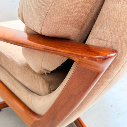 Close-up of a Vintage Mid Century Tessa T21 Swivel Chair (Revive), showcasing cream velvet cushions and a polished wooden frame, highlighting the signature smooth finish and craftsmanship of classic mid-century design.