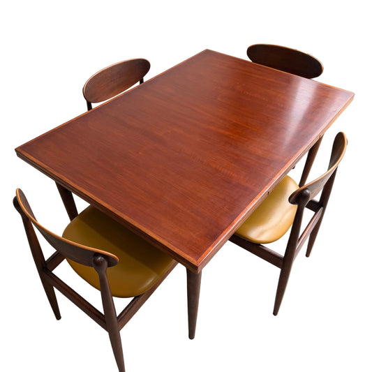 A Vintage Mid-Century Parker 109 Nordic Extension Dining Table in teak with a reddish-brown finish sits against a white background.