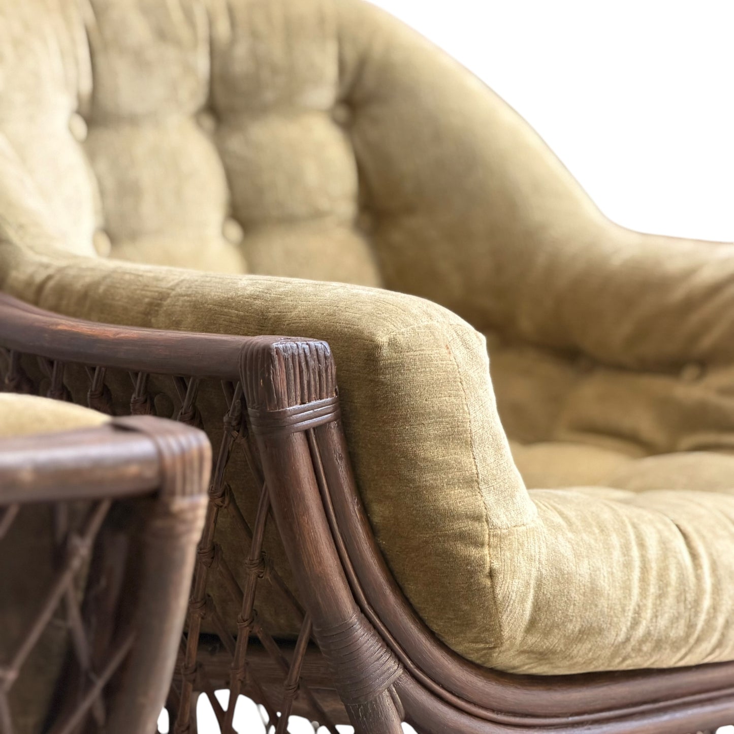 Close-up of a Vintage Adrian Pearsall Style 1970s Rattan Designer Barrel Chair in olive green velvet, featuring button-tufted upholstery and armrest details, shown against a white background.