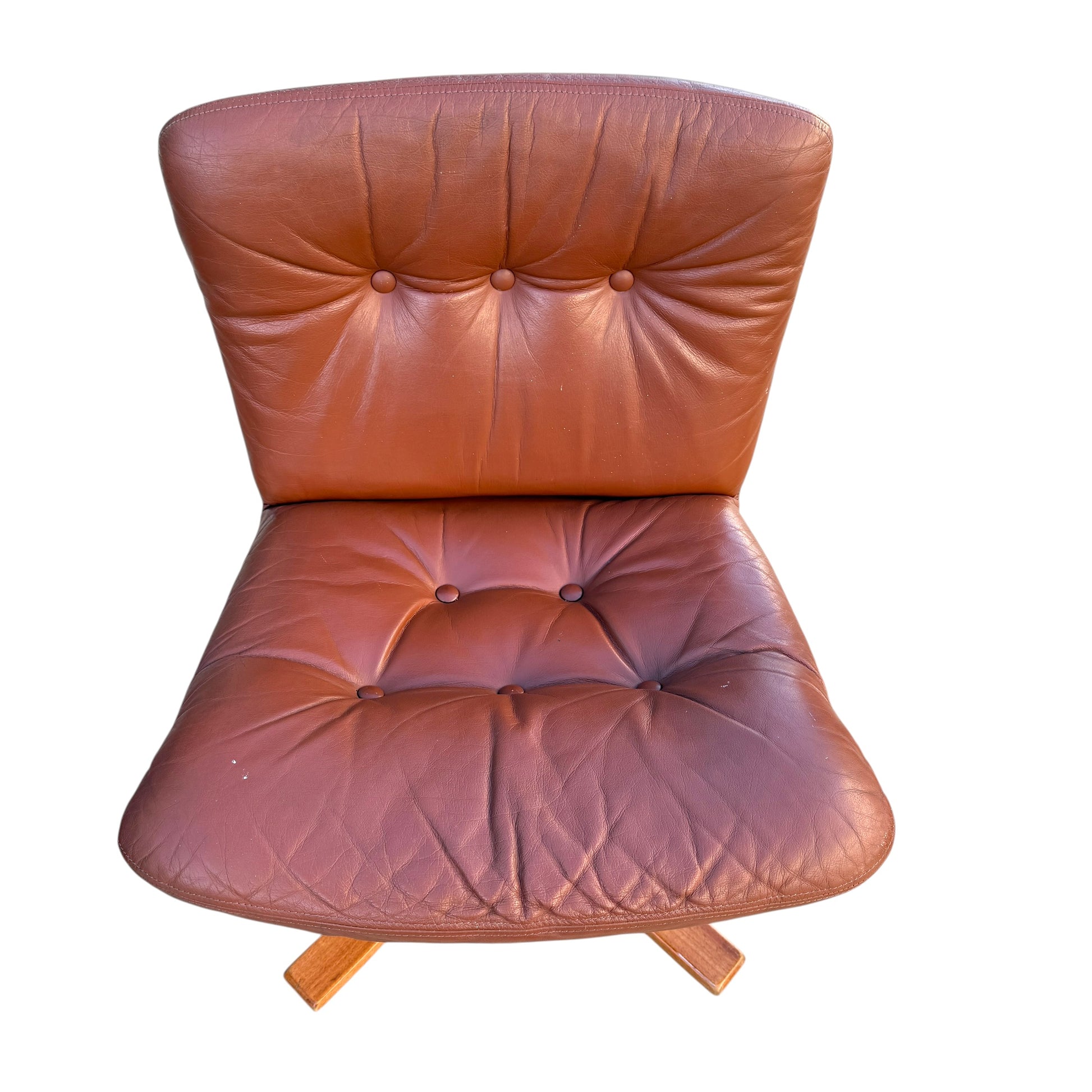 A rare set of 4 vintage Joe Rufenacht lounge chairs in Howe leather, featuring button-tufted backs and seats, wooden legs, and classic Scandinavian design, viewed from above against a white background.