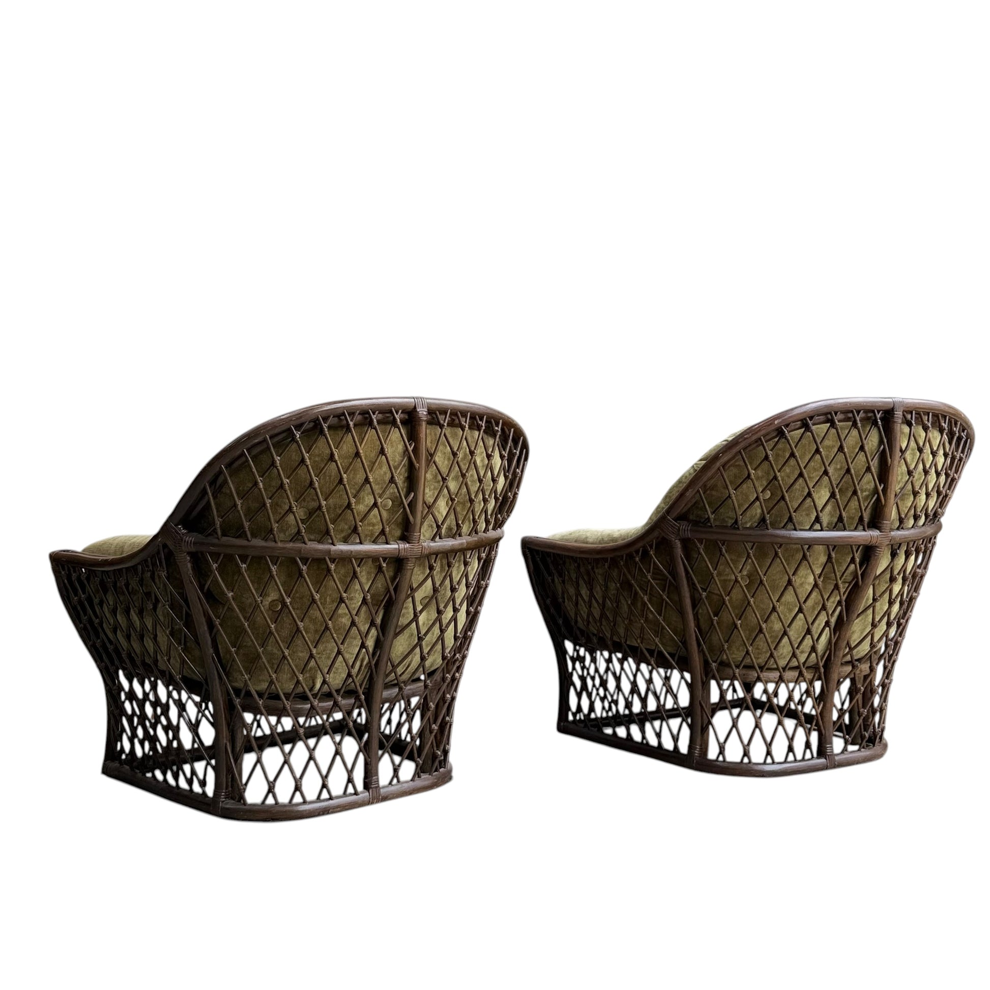 Two Vintage Adrian Pearsall Style 1970s Rattan Designer Barrel Chairs with olive green velvet cushions and woven lattice design, featuring rounded backs, are placed side by side on a white background.