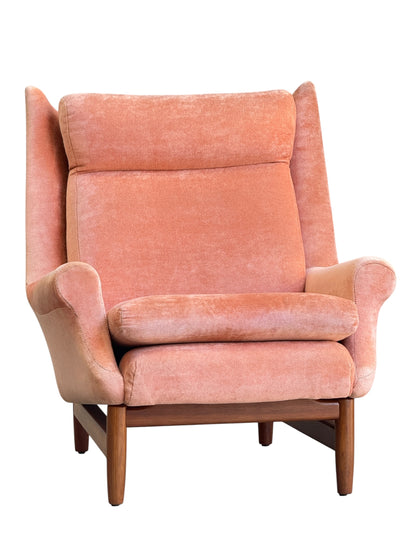 The Mid-Century High-Back/Wingback Armchair in dusty pink velvet with Blackwood frame and wooden legs is shown against a white background, echoing classic mid-century style. Priced individually.