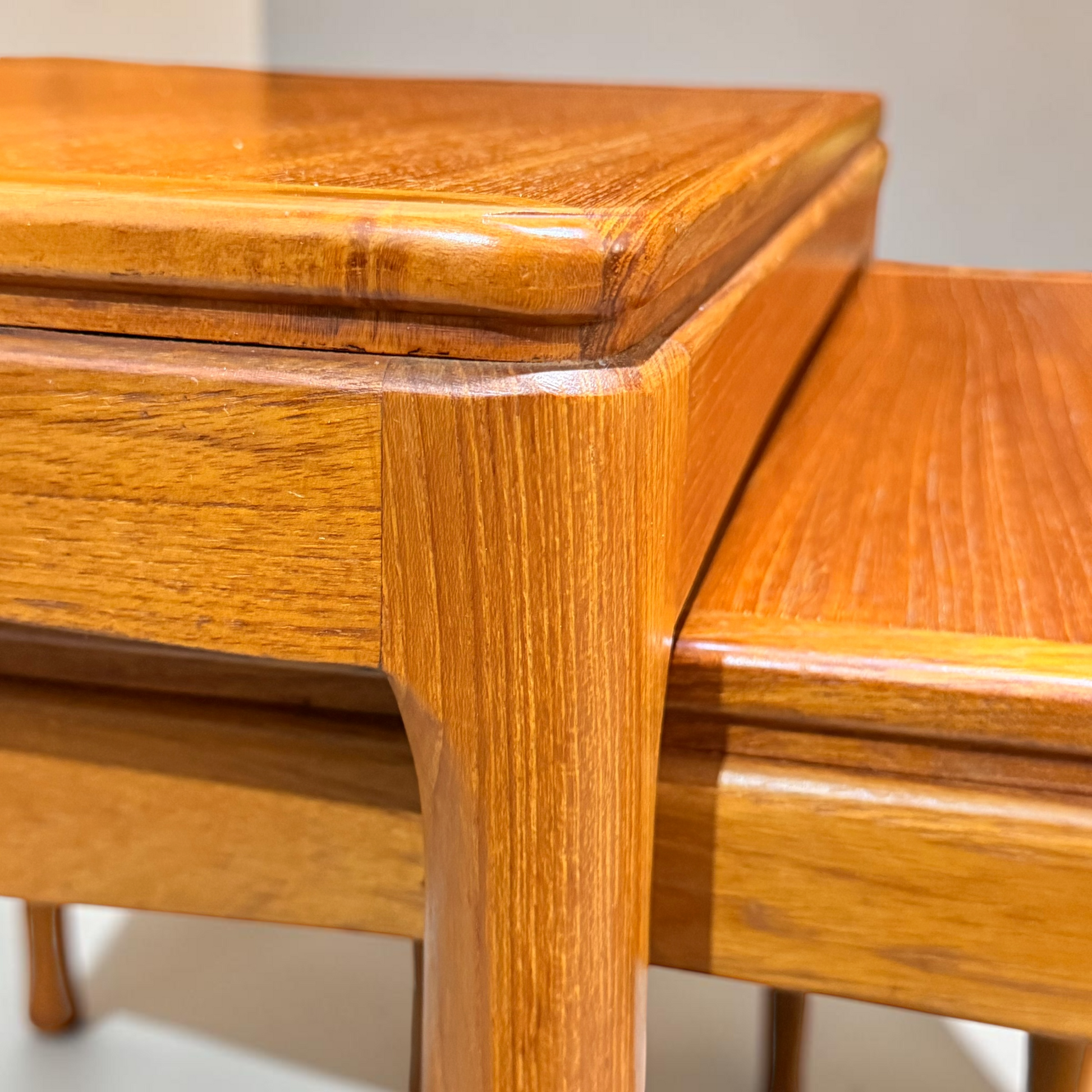 Close-up of the Rare set of Alpa Teak Nesting Tables – Set of 3, featuring smooth, polished finishes and detailed grain. Expertly stacked to showcase classic Australian mid-century modern craftsmanship and clean lines.