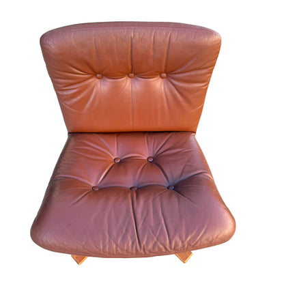 A rare set of 4 vintage Joe Rufenacht lounge chairs in Howe leather, each featuring a brown tufted design with visible creases and wear, photographed from above on a white background—classic Scandinavian style.