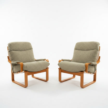A pair of Tessa Monaco Arm Chairs in like-new sage green corduroy, positioned facing slightly toward each other against a white background for a mid-century look.