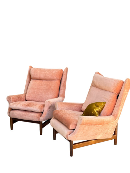 A Mid-Century High-Back Wingback Armchair in dusty pink velvet with elegant Blackwood frame, shown with a mustard yellow accent pillow on a white background. Priced individually.