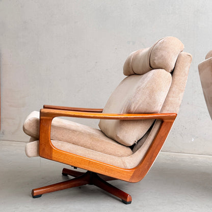 The Vintage Mid Century Tessa T21 Swivel Chair (Revive) features cream velvet upholstery, angled plush cushions, open wooden armrests, and a swivel base—perfect for adding retro flair to any space.