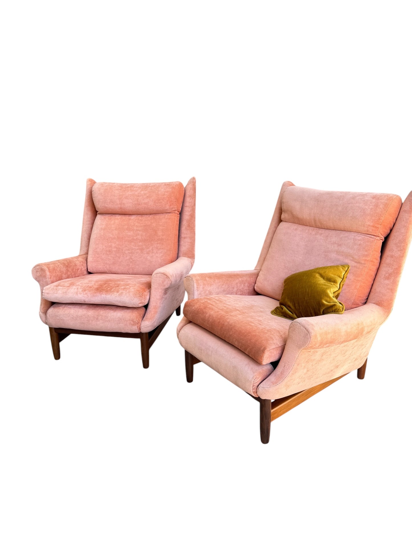 Two Mid-Century High-Back armchairs in dusty pink velvet with Blackwood frames (priced individually). One features a golden yellow cushion. Both are set against a white background.