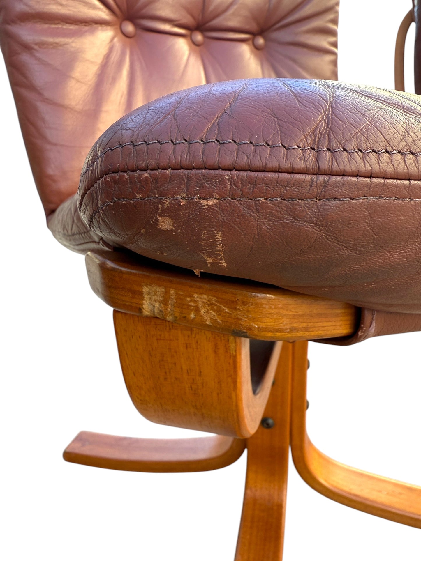Close-up of a Rare Set of 4 Vintage Joe Rufenacht Lounge Chairs in Howe Leather, showcasing visible wear and scratches on the leather and wood for a distressed look with subtle Scandinavian-inspired design.