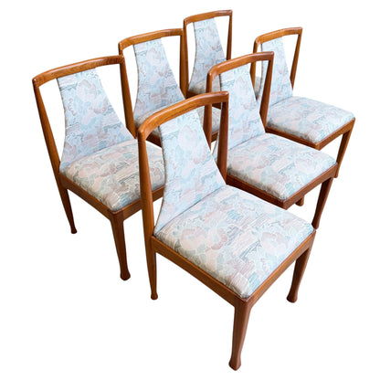 A set of six Vintage CRO Teak Dining Chairs (Revive) is arranged in two rows of three, featuring mid-century modern design with curved backs and pastel-patterned upholstered seats and backrests against a white background.