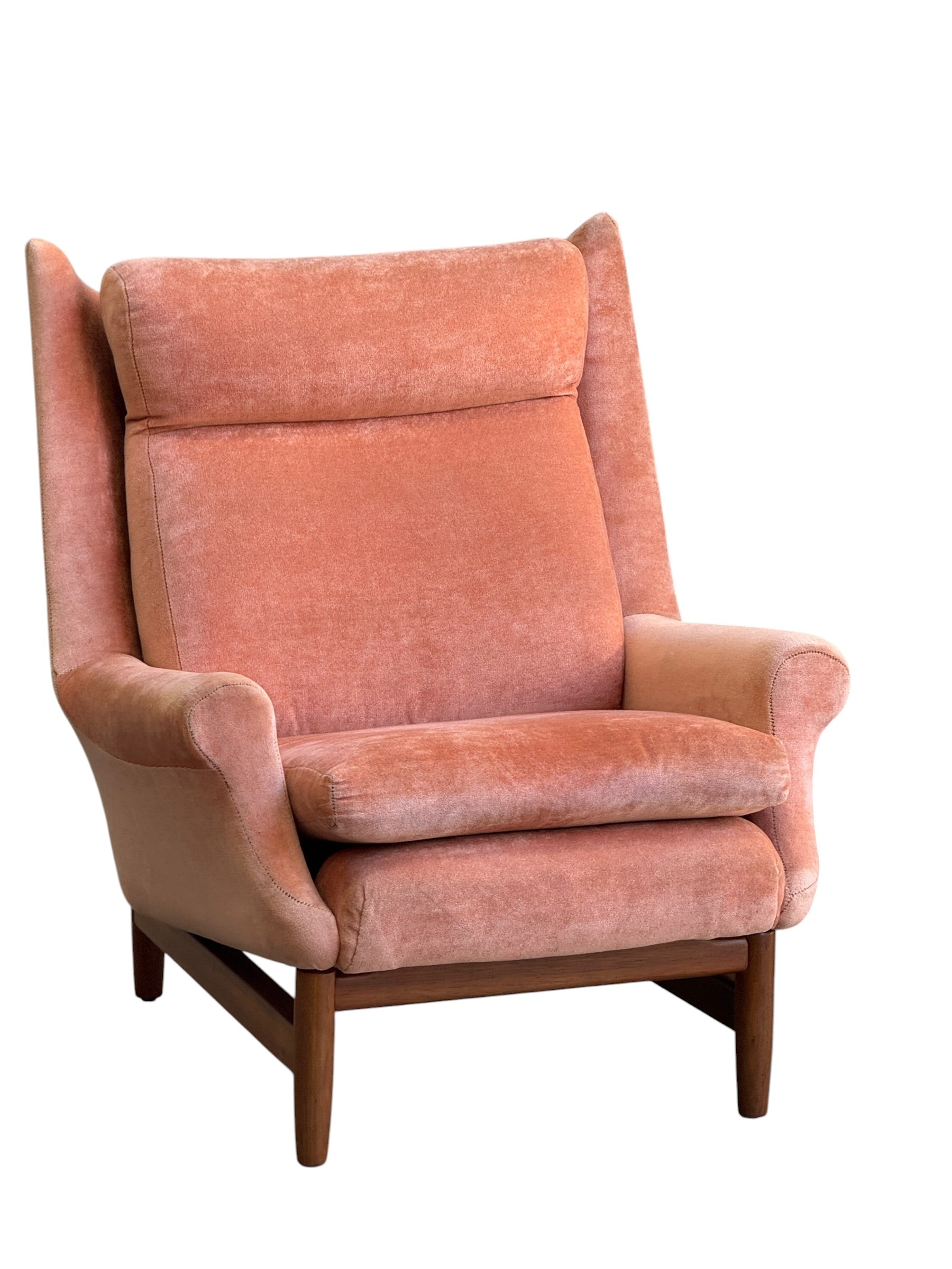A Mid-Century High-Back/Wingback Armchair in dusty pink velvet with blackwood frame, featuring a high backrest and curved armrests, is shown against a white background. Priced individually.