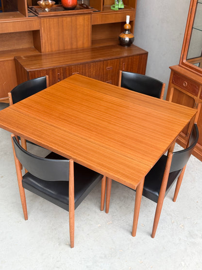 Iconic set of Restored Parker Number 62 mid-century modern dining chair paired with parker extension side table number 95 while extended out to seat four chairs