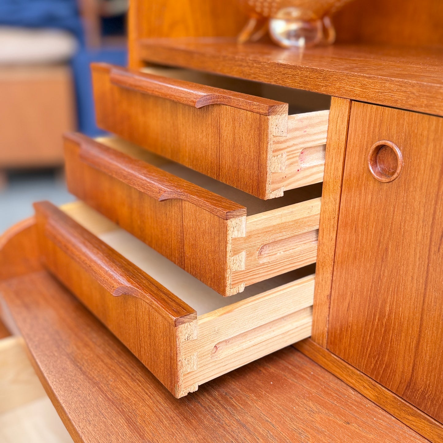 Three wooden drawers partially open in the Danish Teak Bureau Bookcase Secretary Desk by Erik Petersen for EP Møbler, featuring dovetail joints and a polished warm brown teak finish that evokes classic Scandinavian style.