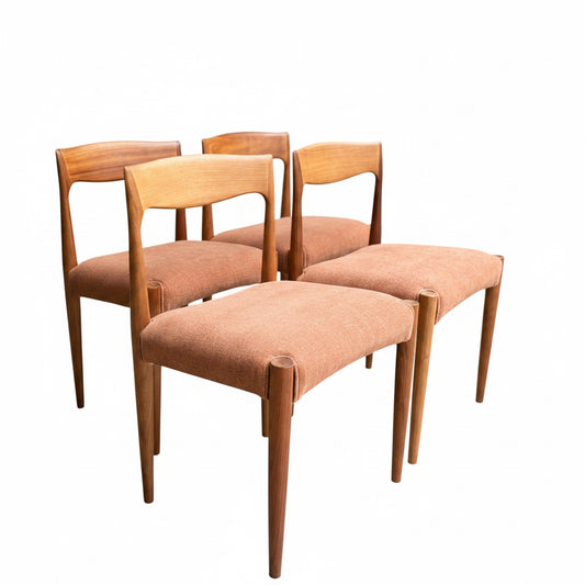 The Fully Restored THB 'Milan' Dining Chairs Set of 4 (Rediscover) are Australian mid-century pieces made from Tasmanian blackwood, each with light brown upholstered seats, shown on a concrete floor amid wooden furniture.