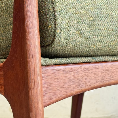 Close-up of the Don Rex Armchair - Green Forest (Rediscover) featuring a smooth, reddish wood frame and green textured speckled upholstery, showcasing classic mid-century Australian furniture style.