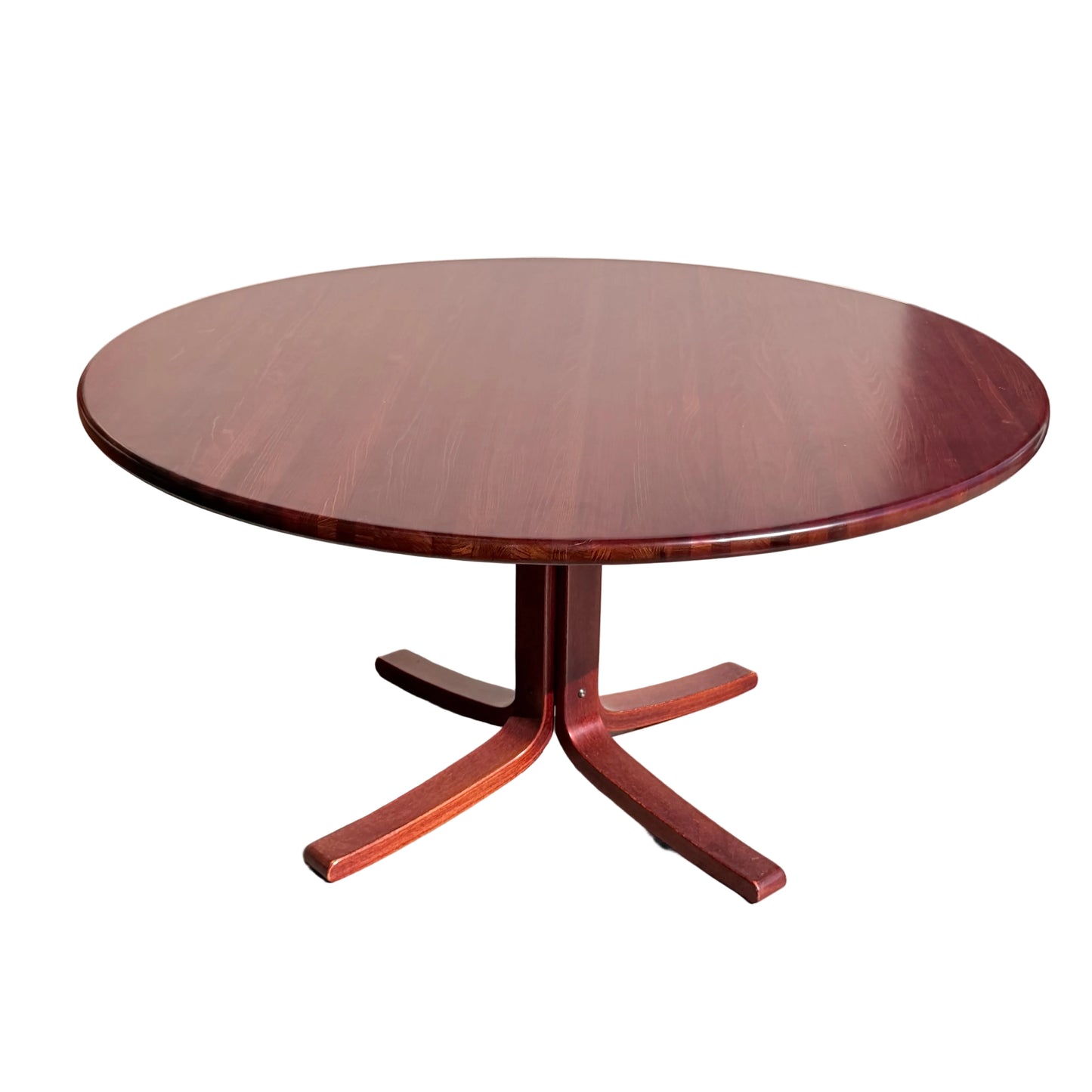 The Joe Rufenacht Designer Round Dining Table – Rare Mid-Century Gem in Solid Wood (Refine) features a central pedestal base with four flat feet, shown on a light concrete floor in natural sunlight.
