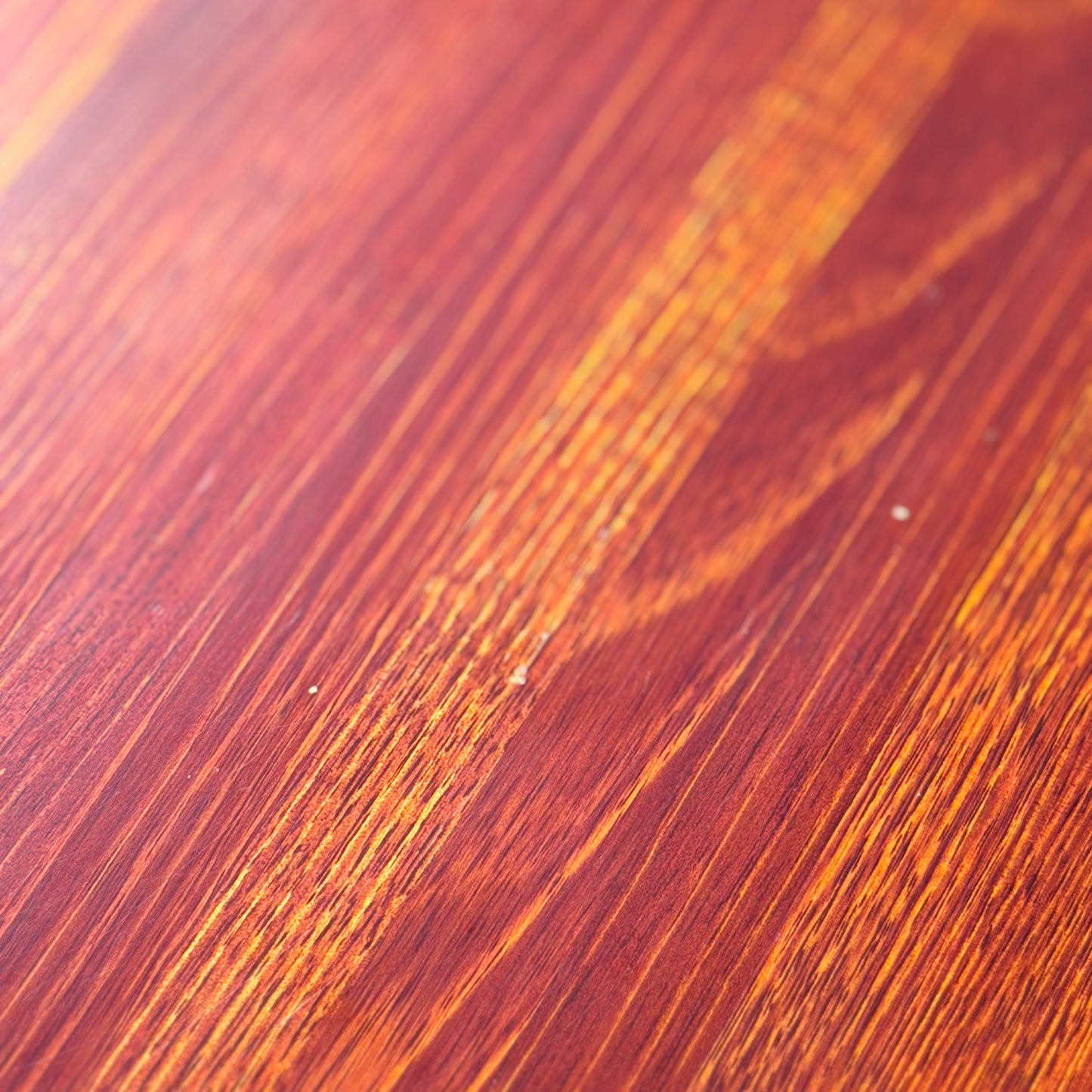Close-up of the Joe Rufenacht Designer Round Dining Table—Rare Mid-Century Gem in Solid Wood (Refine); reddish-brown surface with visible grain and natural texture, ideal for a timeless, modern dining space.