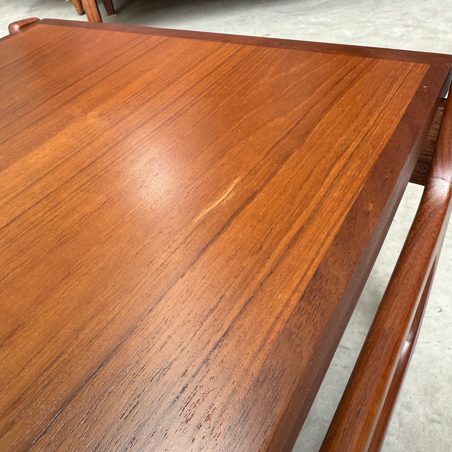 A close-up of the ultra rare Gerald Easden Coffee Table in Blackwood with a sleigh leg base (Rediscover), highlighting its distinctive wood grain and sleek design—a standout piece of Australian vintage furniture.