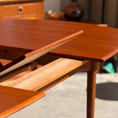 A close-up of a Fully Restored Parker No.92 D End Dining Table (Rediscover) with an extra leaf partially inserted, showcasing its smooth polished surfaces and warm wood tones in sunlight—a stunning vintage Australian piece.