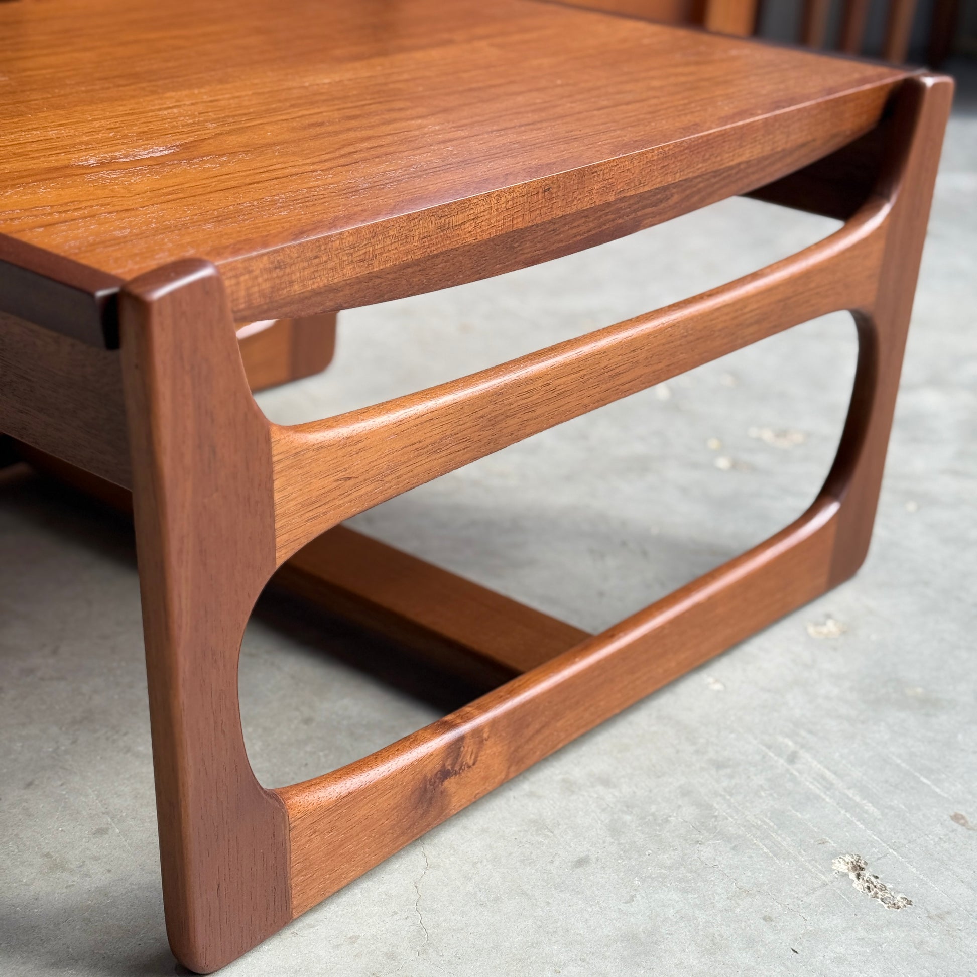 Close-up of the Ultra Rare Gerald Easden Coffee Table’s blackwood sleigh leg base, showcasing smooth curves and mid-century modern design. Warm, rich wood grain highlights this Australian vintage piece from the Rediscover collection.