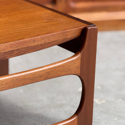 Close-up of the Ultra Rare Gerald Easden Coffee Table in Blackwood with sleigh leg base (Rediscover), featuring a smooth finish and curved mid-century modern design, inspired by Australian vintage furniture on a gray concrete floor.