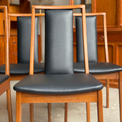 Front Profile of Restored Noblett Boston T-back mid-century modern dining chairs showing open ladder back design and teak legs