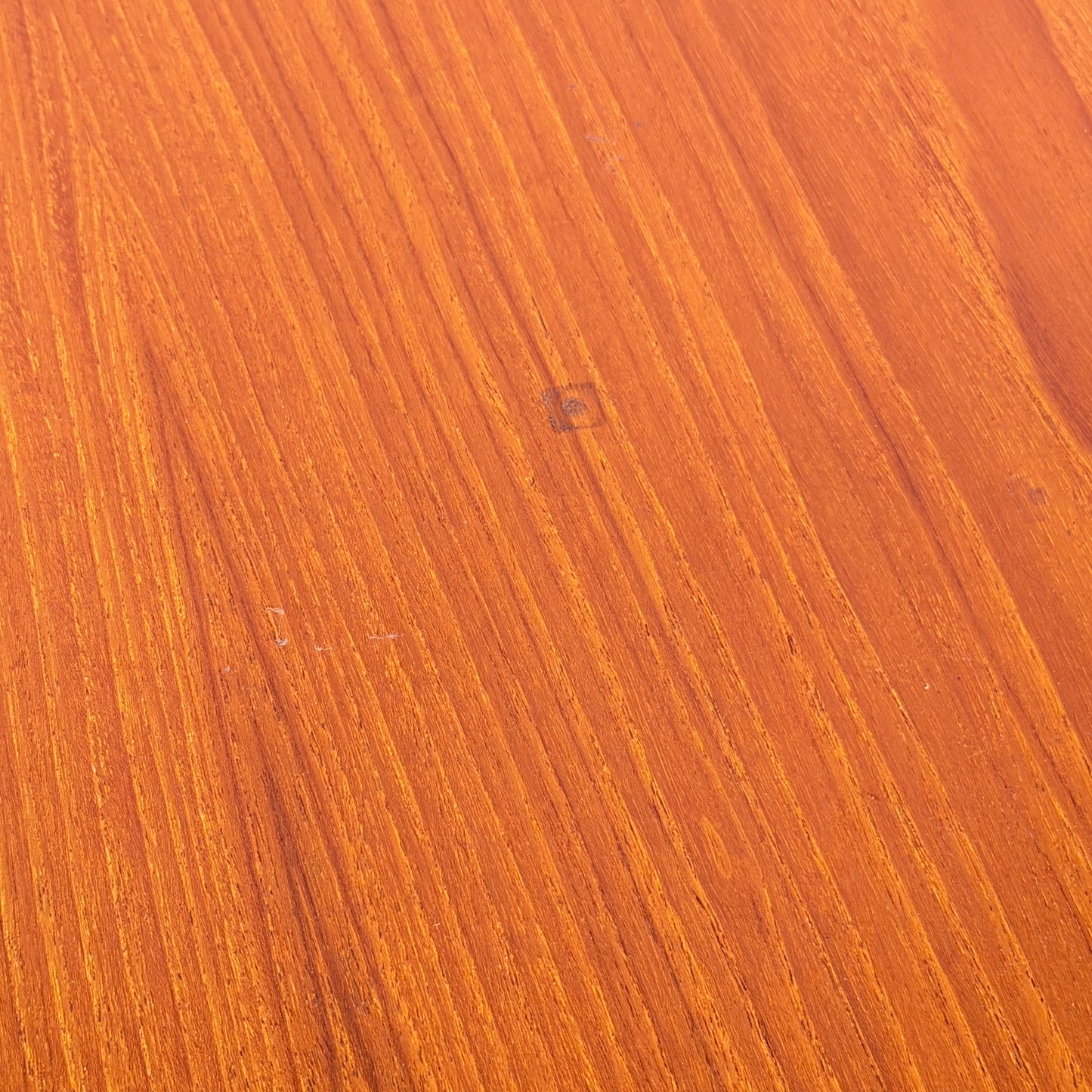 Close-up of the Vintage Parker Dining Suite 5 Piece Square - Number 140, featuring warm brown wood, natural grain patterns, and a small square mark—reflecting Scandinavian-inspired Australian mid-century vintage design.