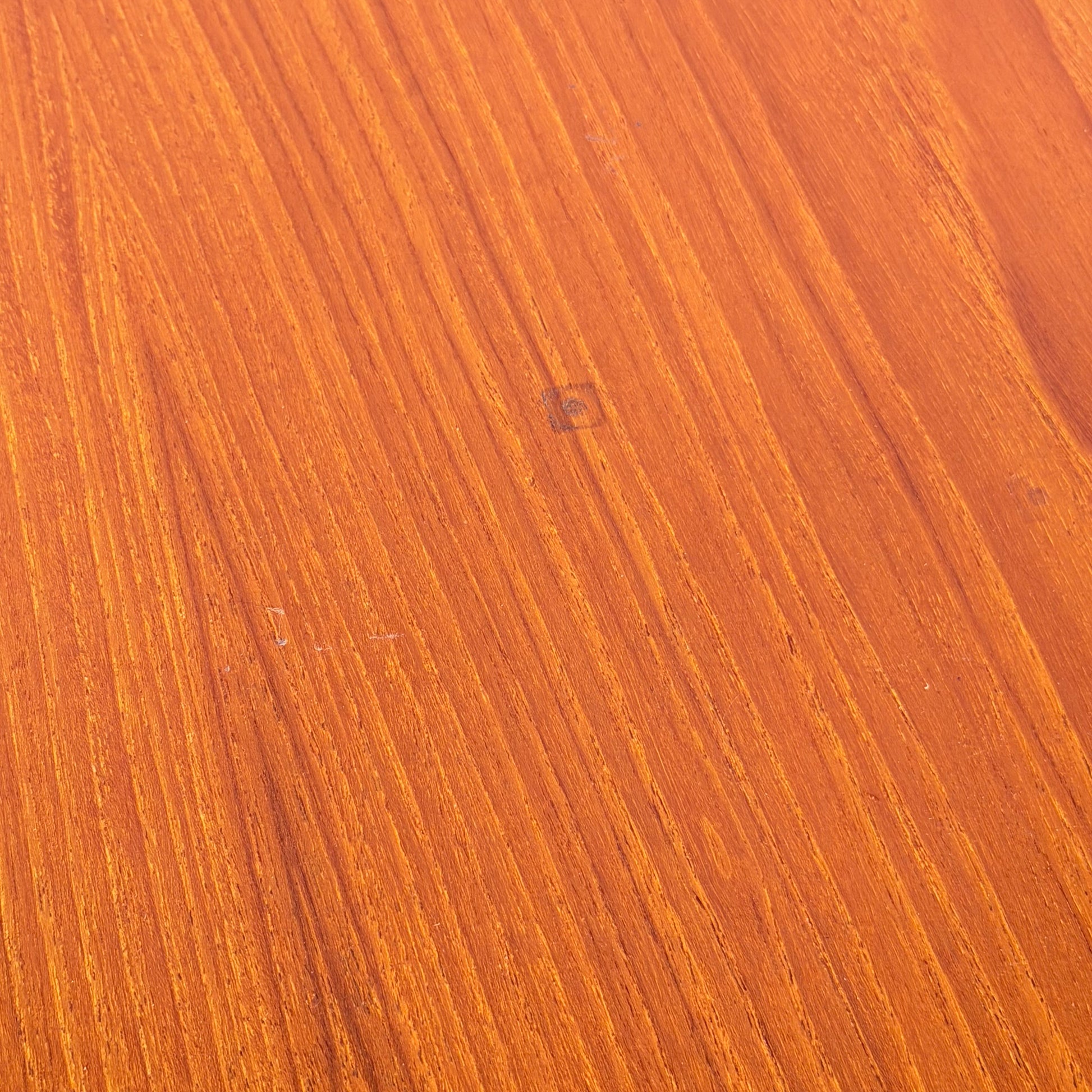 Close-up of the Vintage Parker Dining Suite 5 Piece Square - Number 140, featuring warm brown wood, natural grain patterns, and a small square mark—reflecting Scandinavian-inspired Australian mid-century vintage design.