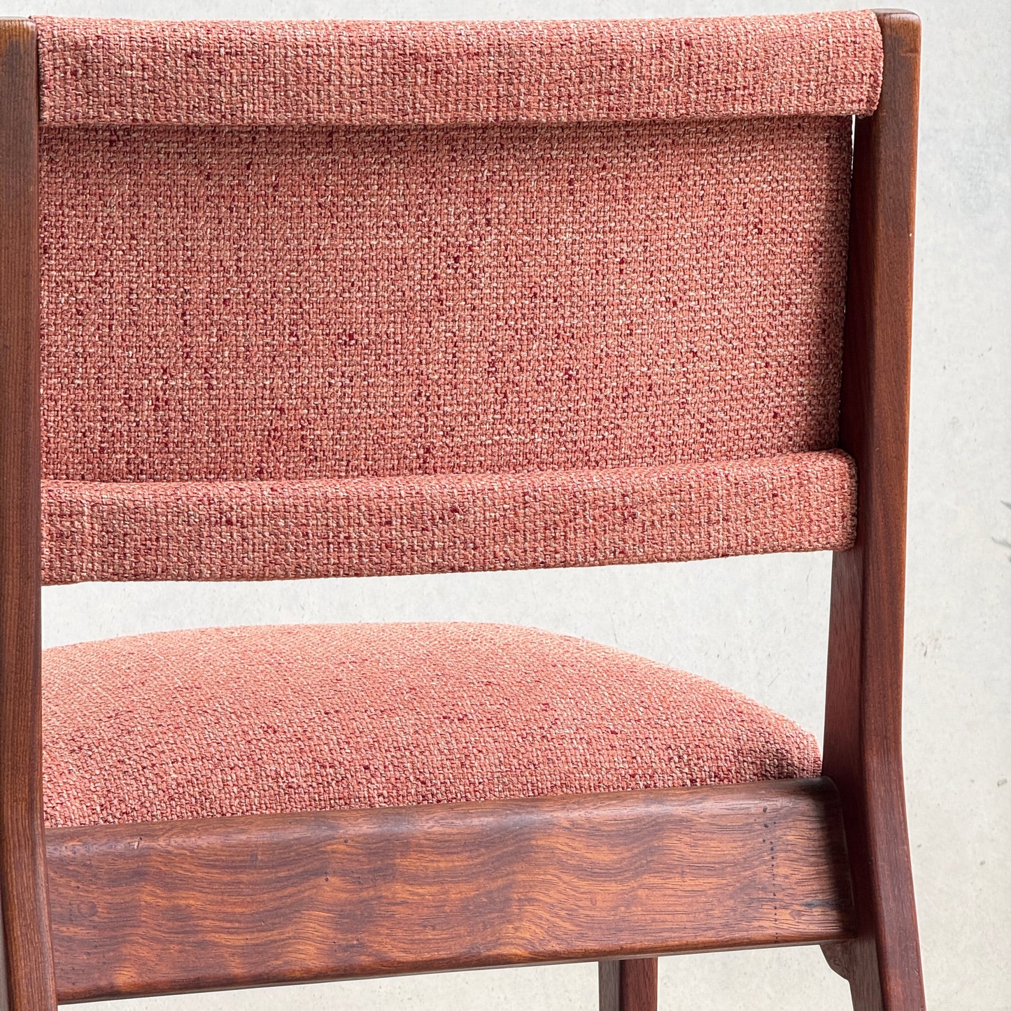 Close-up of a Vintage MCM Jens Risom Chair from a collectable set of 4, featuring textured dusty rose upholstery and classic mid-century modern design, shown against a plain light background.