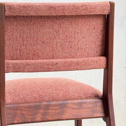 Close-up of a Vintage MCM Jens Risom Chair from a collectable set of 4, featuring textured dusty rose upholstery and classic mid-century modern design, shown against a plain light background.