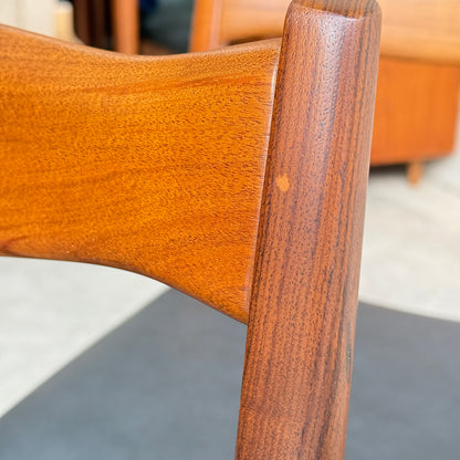 Close-up of the backrest and support of a Fler 64 Blackwood chair from the Fully Restored Mid-Century Parker 91 Oval Teak Dining Suite—smooth, polished finish with visible wood grain and a light spot; classic Australian mid-century detail.