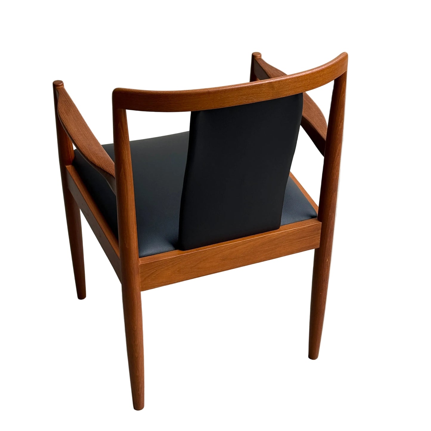 A Pre-Order: Professional Restoration of Parker 89 Chair (25% Non-refundable Deposit) shown from behind with a dark commercial-grade vinyl seat and backrest, restored with clean lines, smooth wooden legs, and a modern minimalist design against a white background.