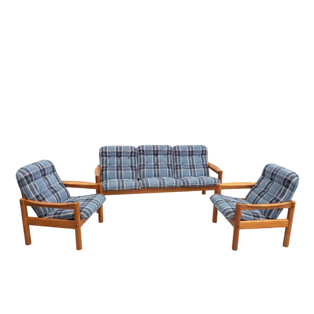 The Vintage Domino Møbler Sofa & Pair of Armchairs – Blue Plaid Mid-Century Set COMING SOON: a Danish Modern suite with a three-seater sofa and two matching armchairs, all wooden-framed with blue plaid cushions on a plain gray background.