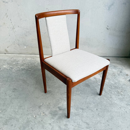 Close-up angled shot of Parker T-back Number 88 dining chair highlighting the signature T-shaped backrest and teak frame