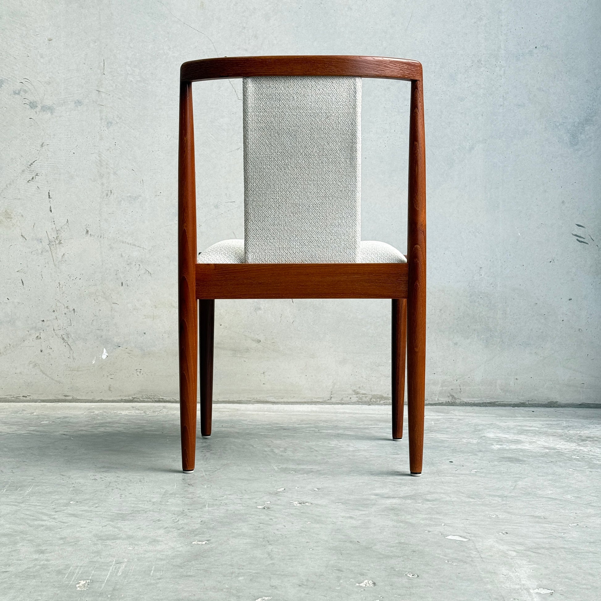 Back shot of Parker T-back Number 88 dining chair highlighting the signature T-shaped backrest and teak frame