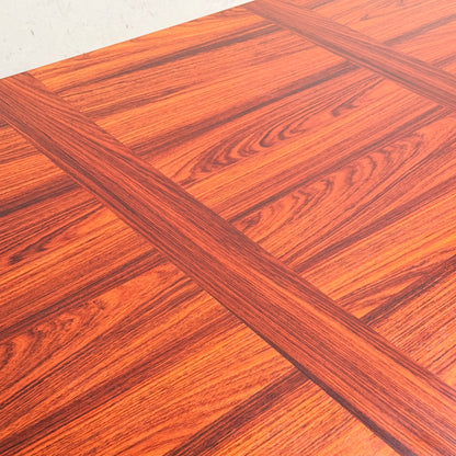 A close-up of the 1970s Danish Modern Rosewood Dropleaf Dining Table (Model 166, 1975) by Vejle Stole og Mobelfabrik shows its rich reddish-brown tone, visible grain, and signature inlaid grid pattern—classic mid-century Danish design.