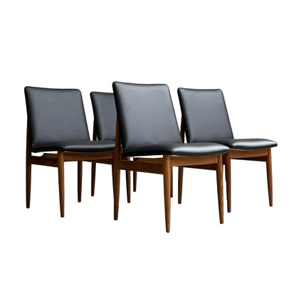 Set of 4 professionally restored Parker 118 Slab Back Chairs, available for pre-order with a 25% non-refundable deposit; featuring black leather seats and backs, and wooden frames.